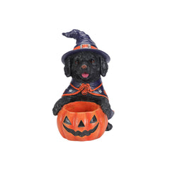Black labrador witch puppy resin figure on a plain background, three quarter view, showing the purple lined hat band