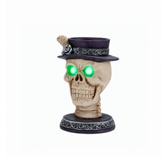 Feather hat skull candle holder decor on a plain background, side view, with the wide open jaw