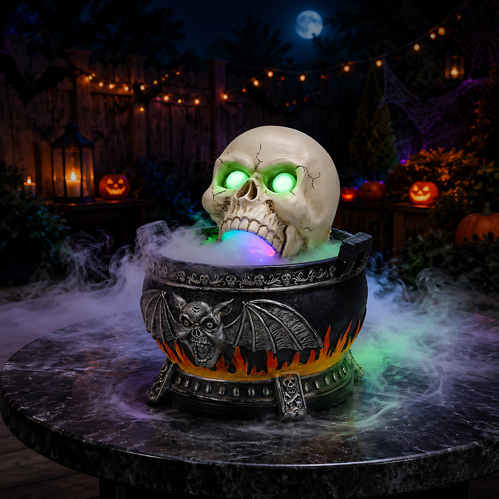 Halloween skull cauldron statue sitting on a dark bar table at night with fog spilling over the rim and green light in the eye sockets