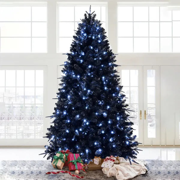 Day and night comparison of the black tree showing its white lights