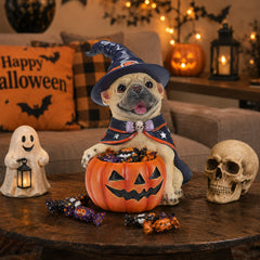 The same dog Halloween decoration from a second angle on a console table with a ghost garland in the background