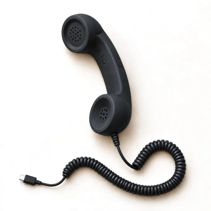 Retro smartphone handset, black, with the USB-C plug