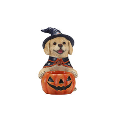Labrador witch puppy resin figure on a plain background, three quarter view, showing the hat and the cape