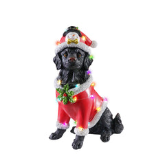 Black retriever Christmas statue in the red Santa coat on a white background, three quarter view, with the light bulbs on the coat