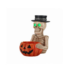 Skeleton holding a jack o lantern treat bowl on a plain background, three quarter view, showing the ribcage and the flat hat top
