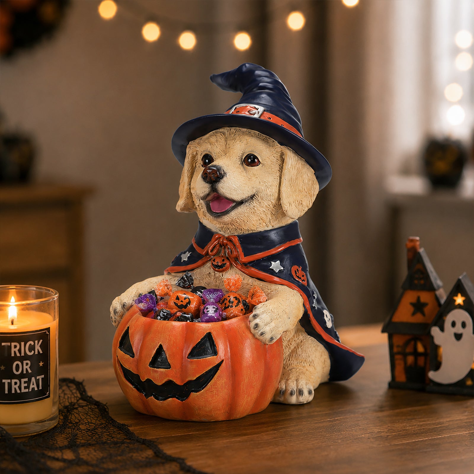 The same labrador witch puppy on a mantel with a boo banner and small pumpkins around it
