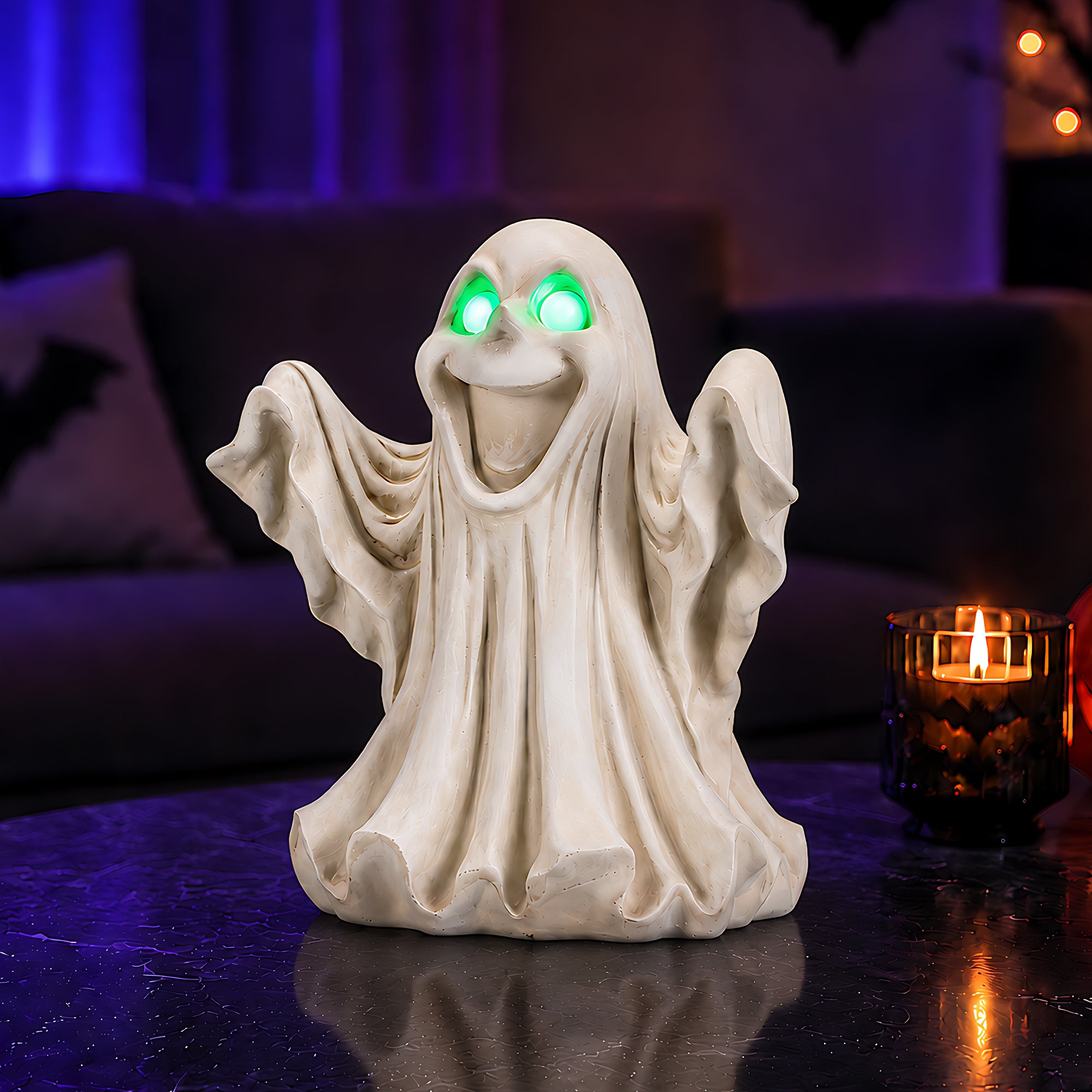 The same resin ghost Halloween statue from a second angle on a sideboard with pumpkins nearby