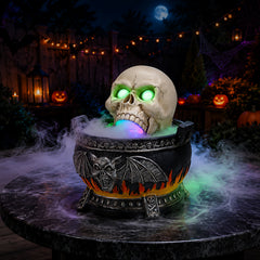 Halloween skull cauldron statue sitting on a dark bar table at night with fog spilling over the rim and green light in the eye sockets