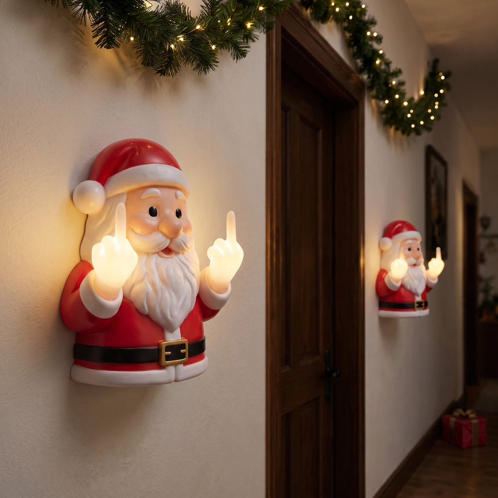 Funny Santa porch decor at night - warm-glow fists visible from the street
