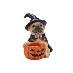 French bulldog wearing a witch hat and cape over a jack o lantern bowl on a plain background, front view