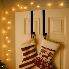 One stocking hung from a black over door hanger in a bedroom doorway