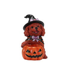 Brown poodle witch statue on a plain background, front view, with the bowl of candy between its paws