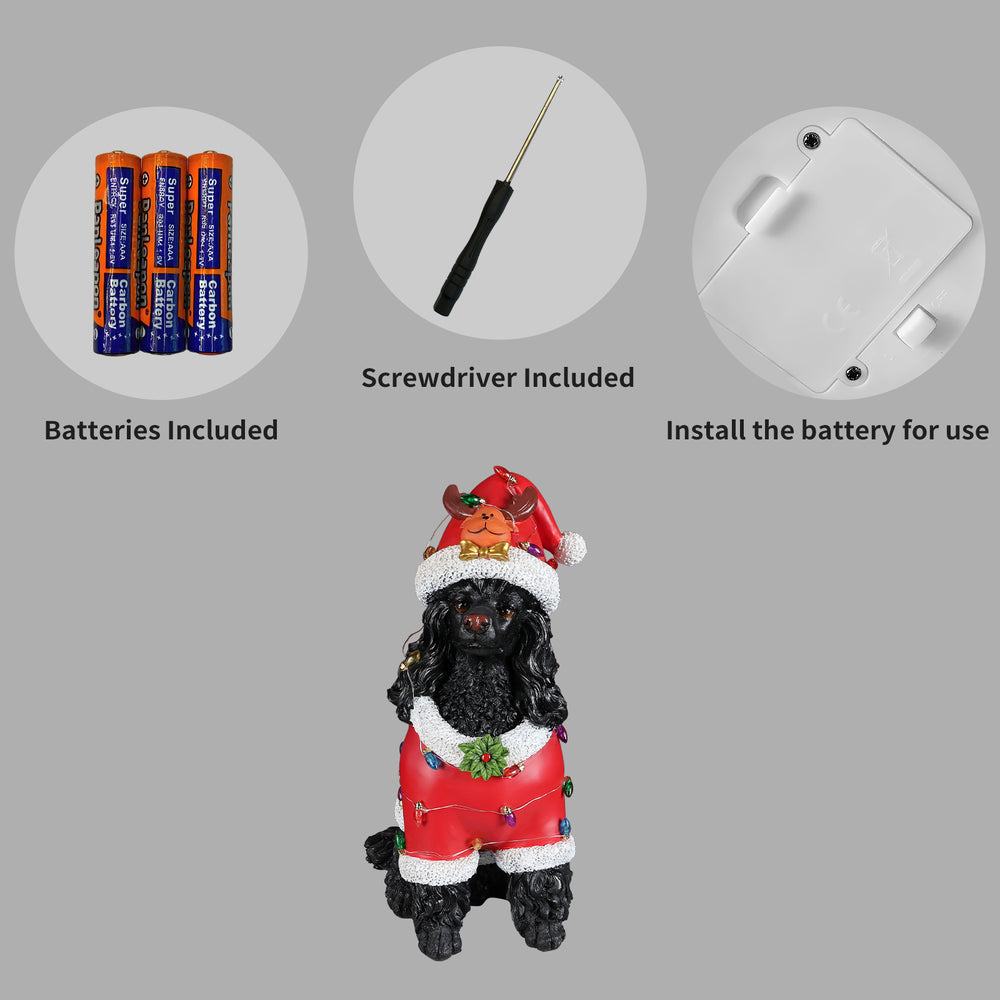 Panel showing what is included with the Black poodle statue: the batteries, the small screwdriver and the cover plate on the underside of the base