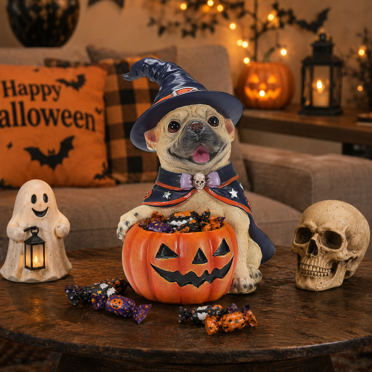 The same dog Halloween decoration from a second angle on a console table with a ghost garland in the background