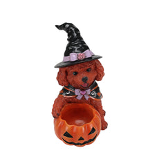 Brown poodle witch statue on a plain background, from a second angle, showing the empty pumpkin bowl