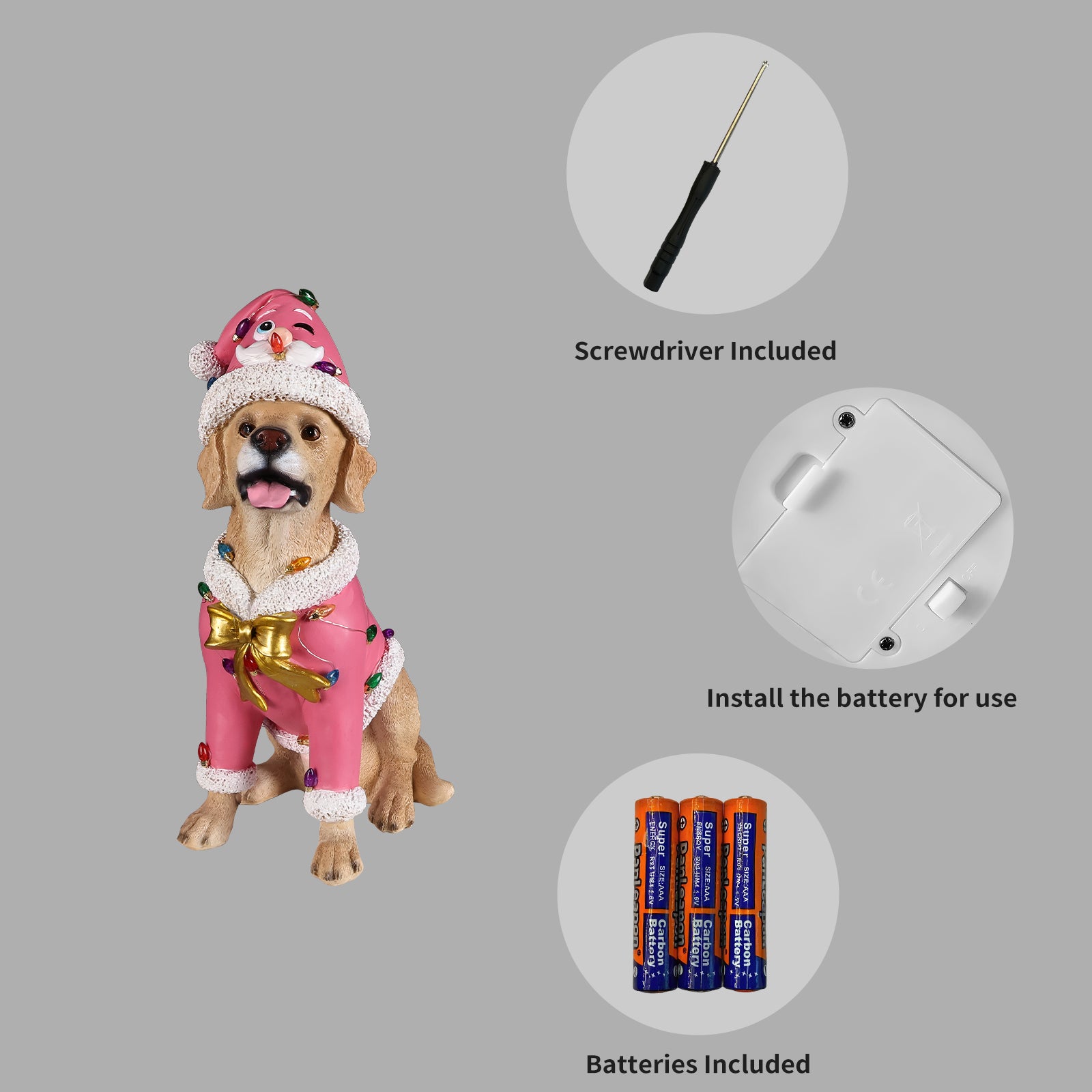Panel showing what is included with the Labrador retriever statue: the batteries, the small screwdriver and the cover plate on the underside of the base