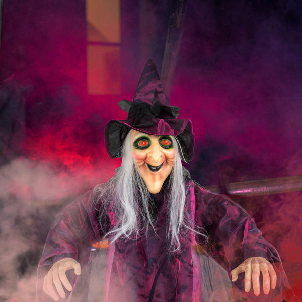 Detail close-ups of the witch face, hands and hidden battery box