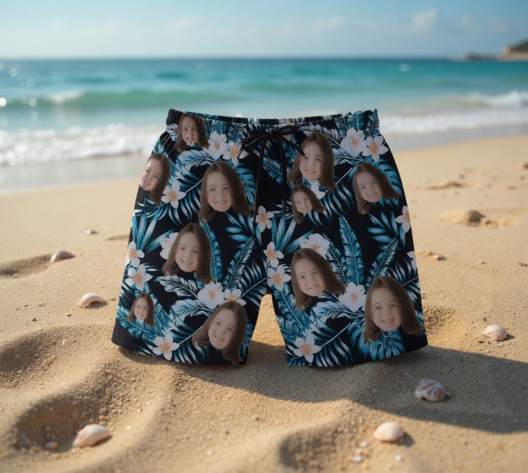 Black Hawaiian Swim Trunks with Blue Leaves & White Plumeria Print