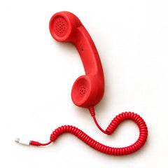 Retro smartphone handset, red, with the Lightning adapter plug