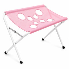 Foldable pet bath and grooming stand, pink surface with leg openings on a folding frame