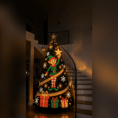 Animated picture: the elf design running on a lit Christmas tree in a stair hall, with the star, the snowflakes and the gifts glowing on