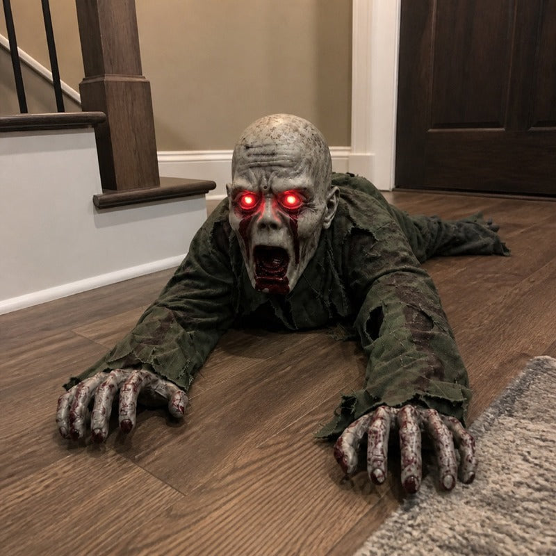 The crawling zombie prop stretched across the bottom of a carpeted entry staircase at night